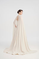Elegant off-white taffeta mikado gown by Tracy Studio, showcasing a flowing, sophisticated dress with intricate details.