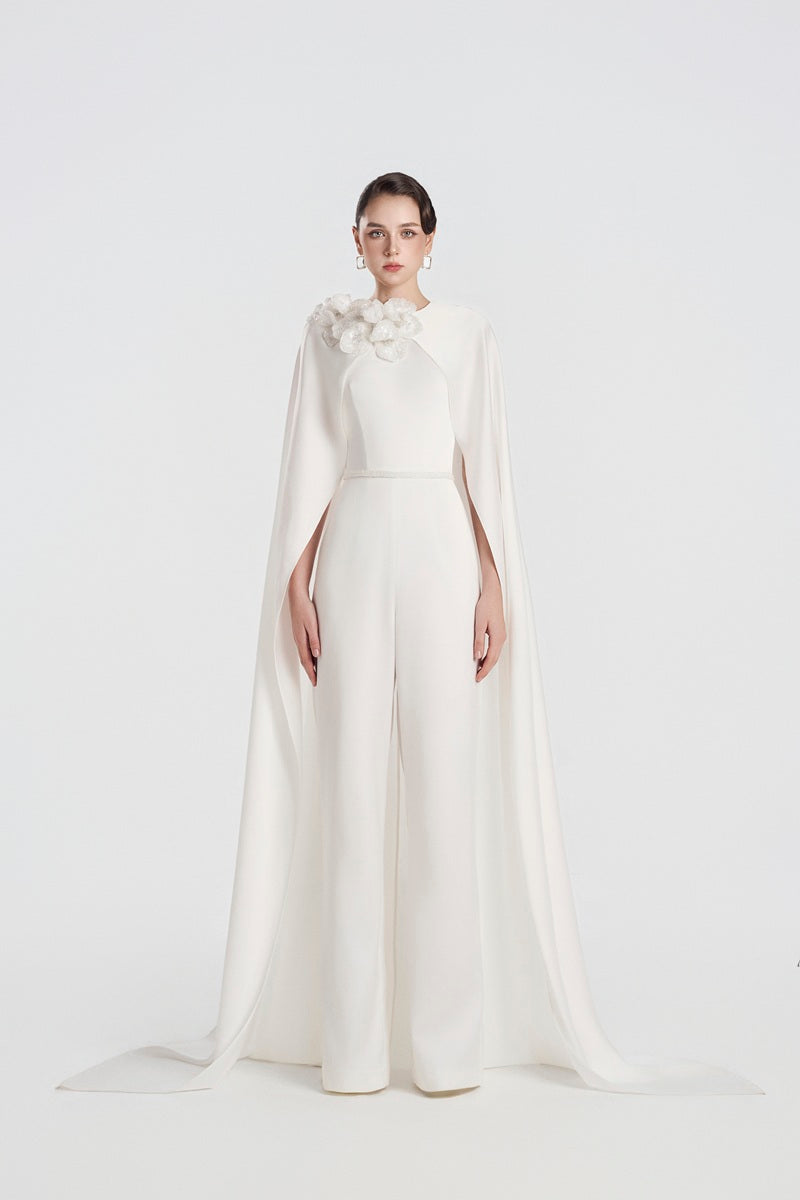 Elegant satin jumpsuit with 3D floral embellishments by Tracy Studio, featuring a sleek maxi dress design and sophisticated style.