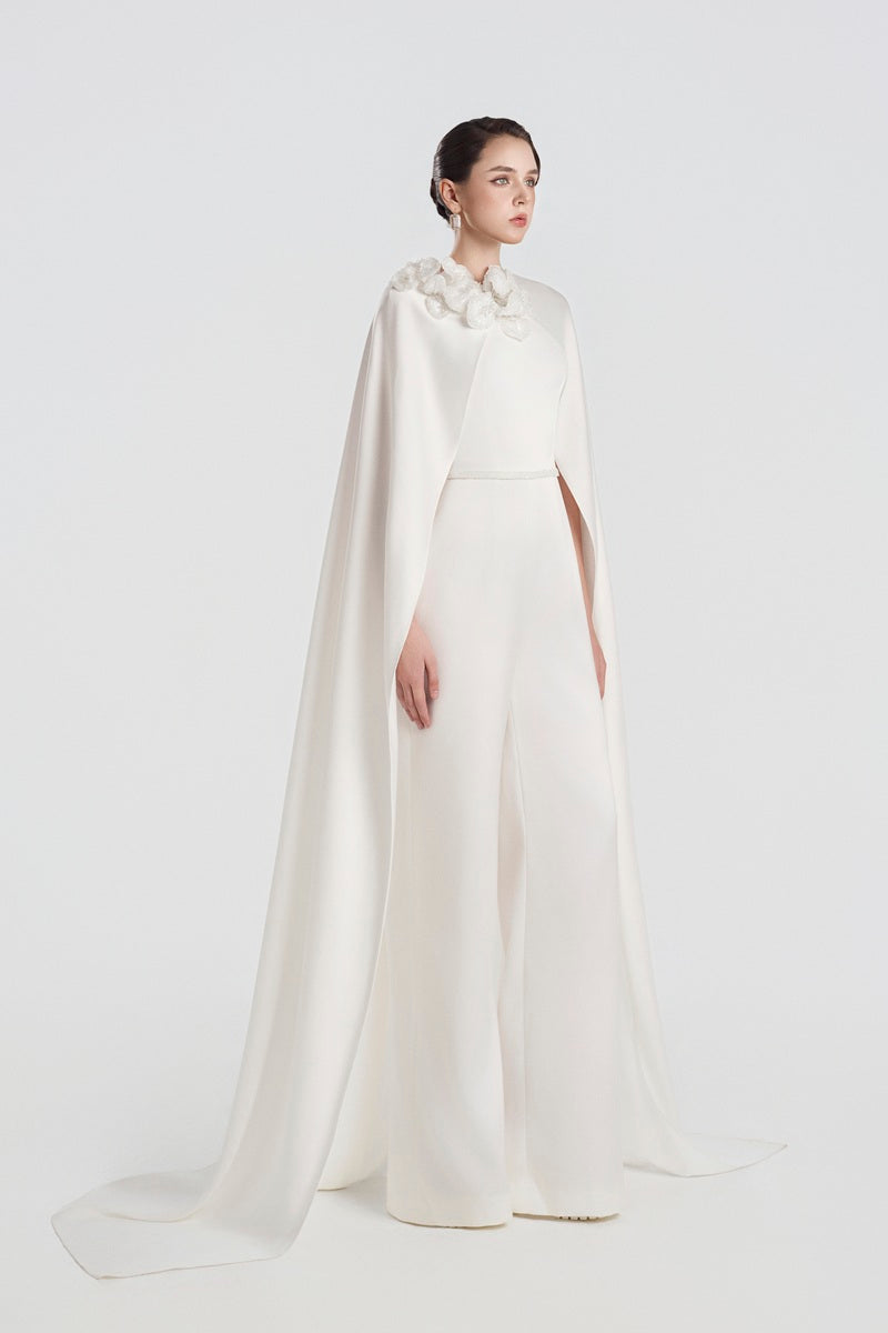Elegant satin jumpsuit with 3D floral embellishments from Tracy Studio, featuring a sleek maxi dress design and stylish fit.