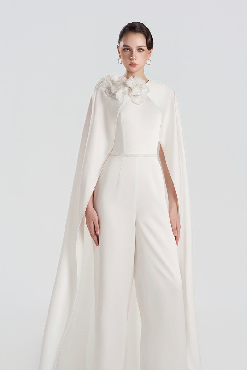 Elegant satin jumpsuit with 3D floral embellishments from Tracy Studio, featuring a sleek maxi dress silhouette and sophisticated style.