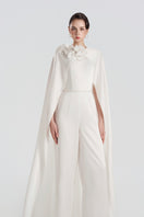 Tracy Studio satin jumpsuit with 3D floral embellishments, featuring a stylish fit and elegant design.