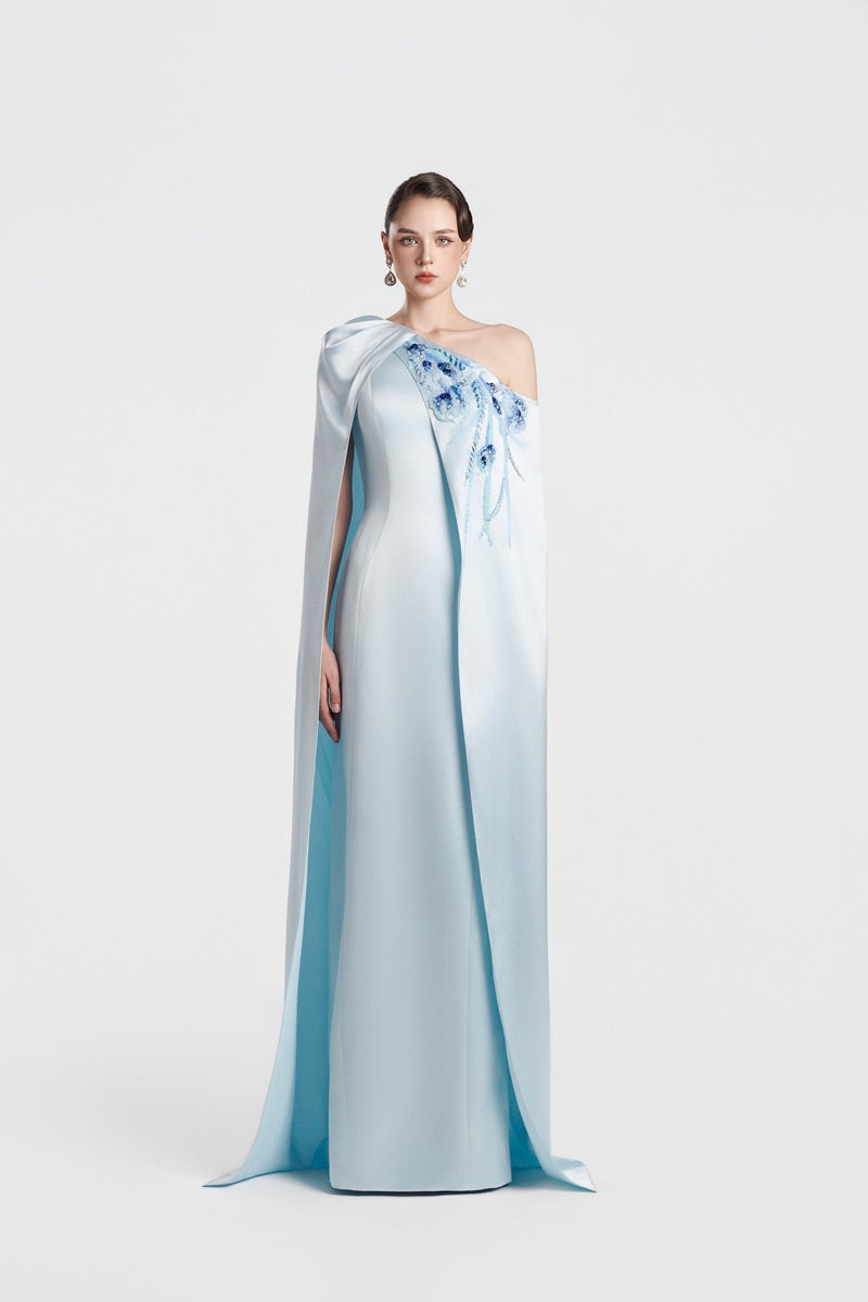 Blue asymmetric taffeta maxi dress by Tracy Studio, featuring elegant draping and a flowy silhouette.