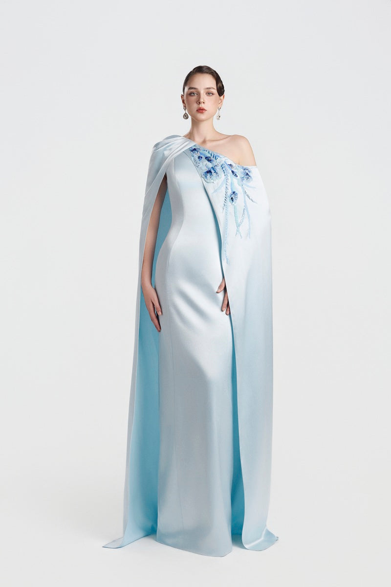 Blue asymmetric taffeta maxi dress by Tracy Studio, featuring elegant draping and a modern silhouette.