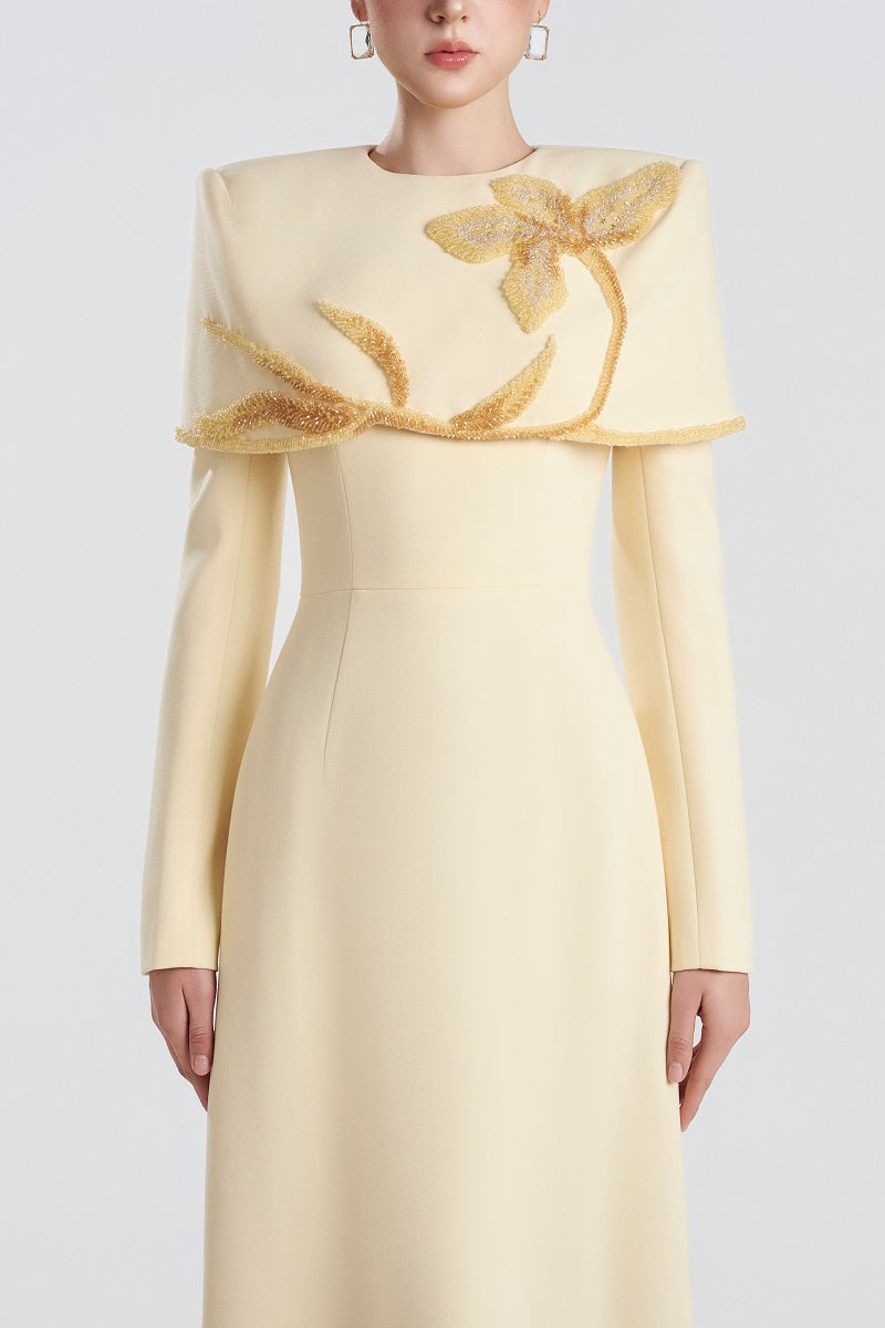 Yellow viscose maxi dress by Tracy Studio, flowing and elegant, displayed on a mannequin with a relaxed fit and smooth fabric.