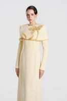 Yellow viscose matte gown by Tracy Studio with flowing fabric and elegant design, perfect for formal occasions.