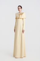 Yellow viscose matte gown by Tracy Studio featuring a flowing design and elegant silhouette.