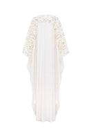 Off-white satin gown with floral sleeve details by Tracy Studio, showcasing elegant, flowing fabric and intricate floral accents.