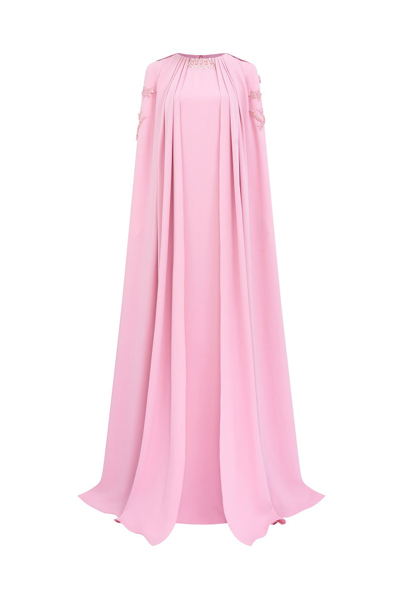 Pink velvet satin cape dress from Tracy Studio, a maxi dress with flowing fabric and elegant design, shown on a model.