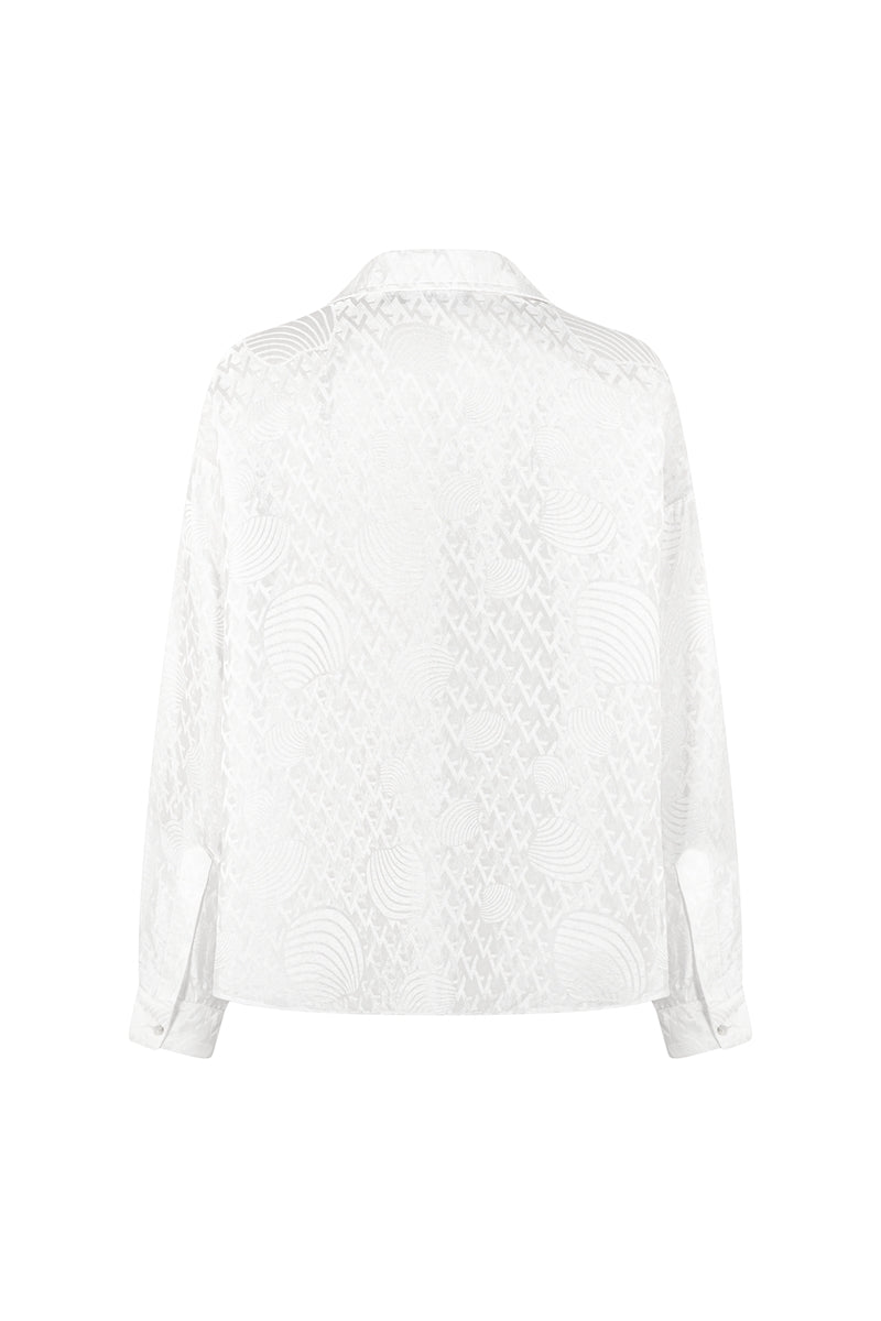 White silk shirt by Valenciani, featuring a smooth, elegant fabric and classic button-down design, displayed on a hanger.
