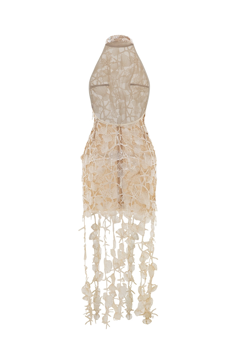 Valenciani Thalassa halter maxi dress in ivory, flowing fabric with a halter neckline and elegant design displayed in V25.jpg.