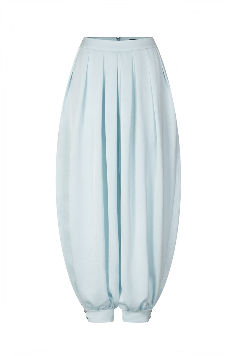 Sky blue balloon pants by Valenciani, featuring a relaxed fit and lightweight fabric, shown on a model.