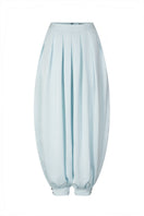 Sky blue balloon pants by Valenciani, featuring a relaxed fit and lightweight fabric, shown on a model.