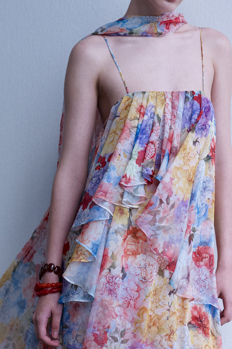 AISA Valentina maxi dress in flowing fabric with a fitted bodice and elegant design, showcased on a model.