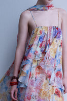 AISA Valentina maxi dress in flowing fabric with a fitted waist and elegant neckline, displayed on a mannequin.