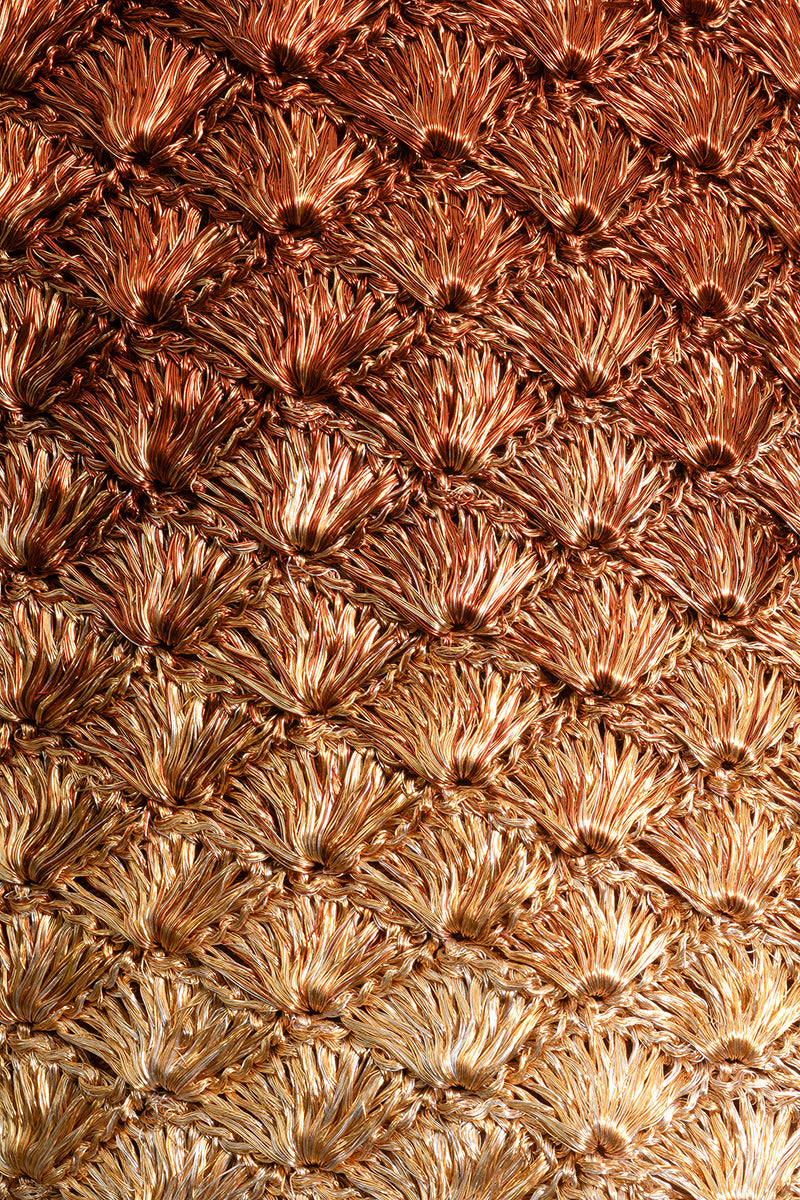Verdi Kaia seashell clutch in gold and copper with metallic finish and intricate shell design, perfect for evening accessories.