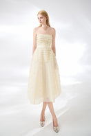 Beige strapless stone organza midi dress by Happy Clothing, featuring a flowing design and elegant fabric details.