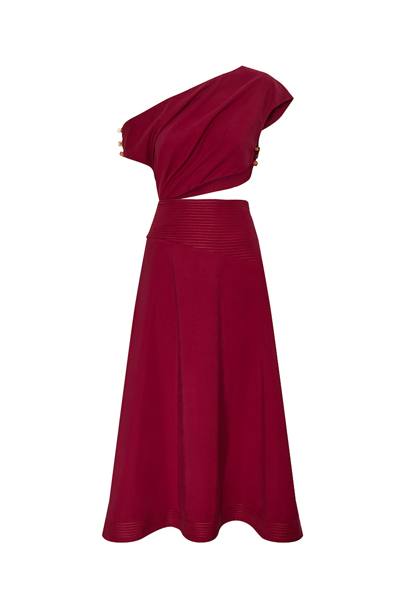 DUMA&CO Rezo midi dress in vibrant floral print, sleeveless with a fitted waist and flowing hem, on a model.