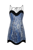 DUMA&CO DESTINO mini dress in vibrant fabric, featuring a stylish sleeveless design and knee-length cut.