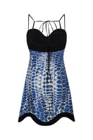 DUMA&CO Destino Dress mini dress in vibrant floral print, sleeveless design with fitted silhouette, perfect for summer wear.