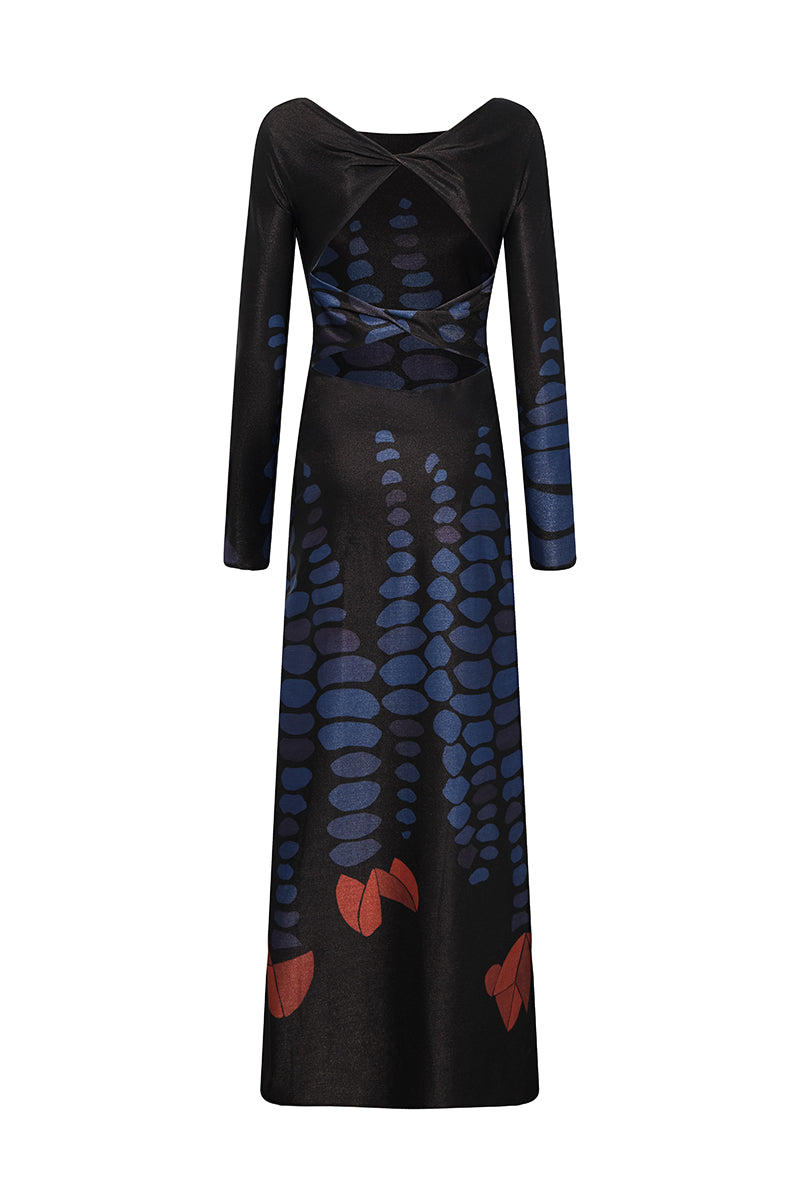 DUMA&CO Amanecer Maxi Dress with flowing fabric and floral pattern, displayed on a hanger.