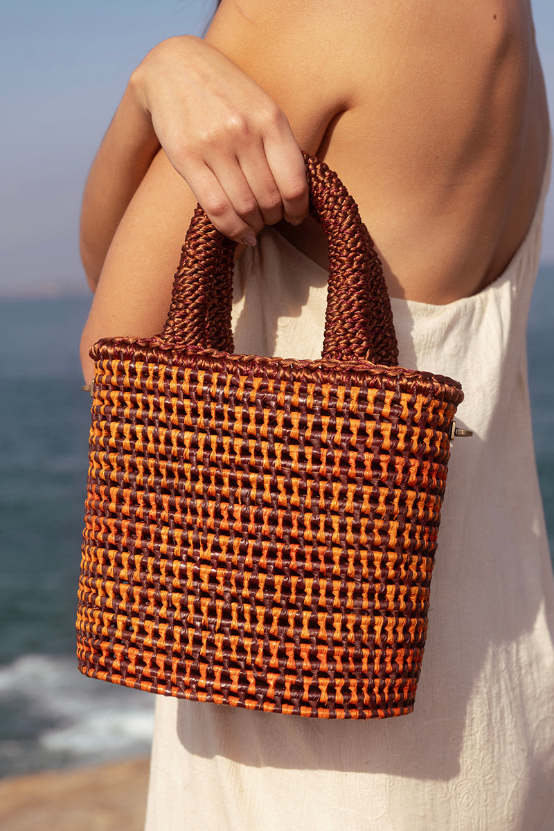 Mara Brazil orange VIDA top handle bag with sleek design, featuring a structured shape and stylish handle for versatile carry.