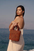 Mara Brazil VIDA orange top handle bag with sleek design and sturdy handles, stylish accessory for everyday use.