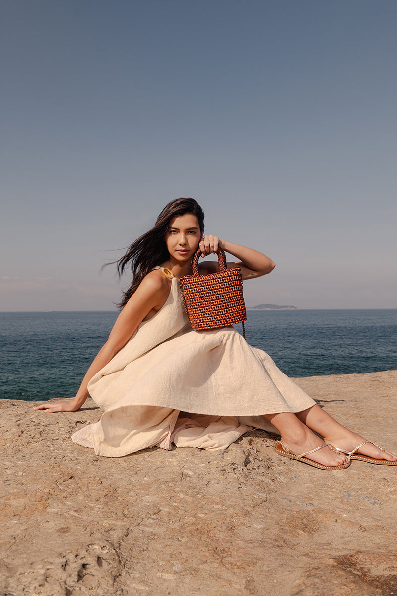 Mara Brazil VIDA orange top handle bag with sleek design and structured shape, featuring a sturdy top handle and vibrant color.
