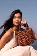 Mara Brazil VIDA orange top handle bag with structured design and sleek leather finish, perfect for stylish everyday use.