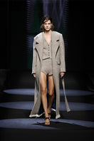 JC Pajares virgin wool vest featuring ceramic buttons, displayed on a runway mannequin with a stylish, tailored appearance.