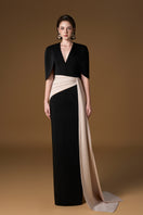 Black and ivory crepe silk lined gown with V-neck and asymmetric draped detail, featuring a mini cape, by I.H.F.