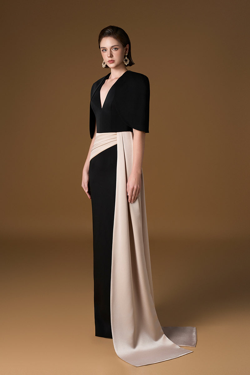 Black and ivory crepe silk lined gown with V-neck, asymmetric draped detail, and mini cape by I.H.F.