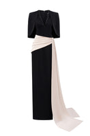 Black and ivory crepe silk-lined gown with V-neck and asymmetric draped detail, featuring a mini cape by I.H.F.