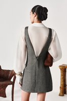 Light blue oversized organza shirt by Levia featuring a V-neck and textured tweed back detail.