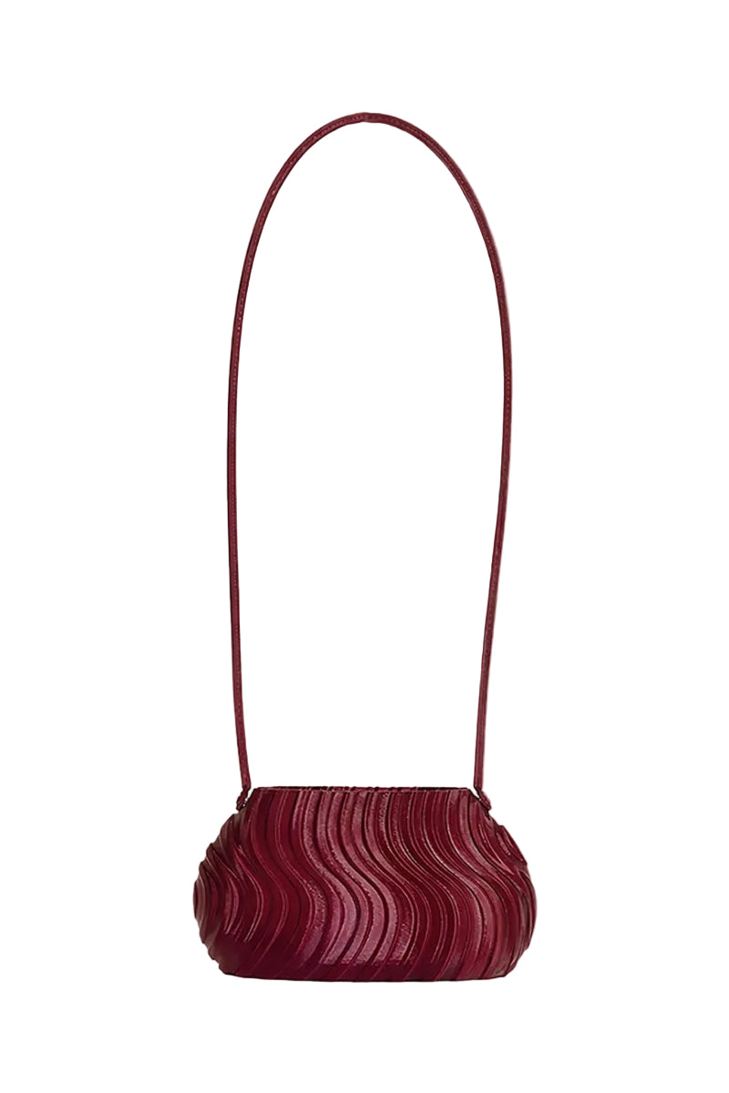 Touchless plum long shoulder bag with adjustable strap, stylish design, and spacious interior for everyday use.