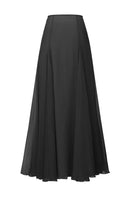 Back view of Nana Jacqueline Valencia black maxi skirt, flowing midi length with a fitted waistband and elegant design.