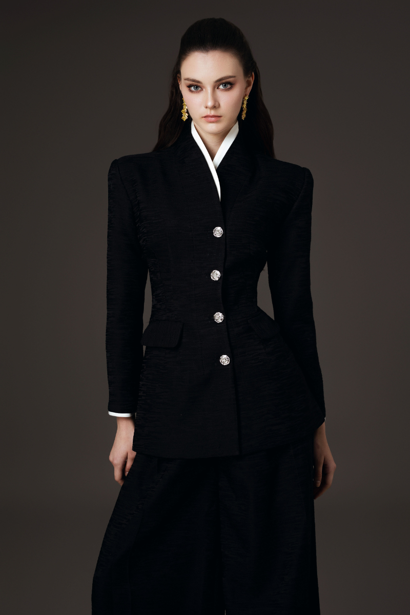 Valenciani high collar fitted blazer and wide-leg trousers co-ords set, displayed on a mannequin with neutral background.