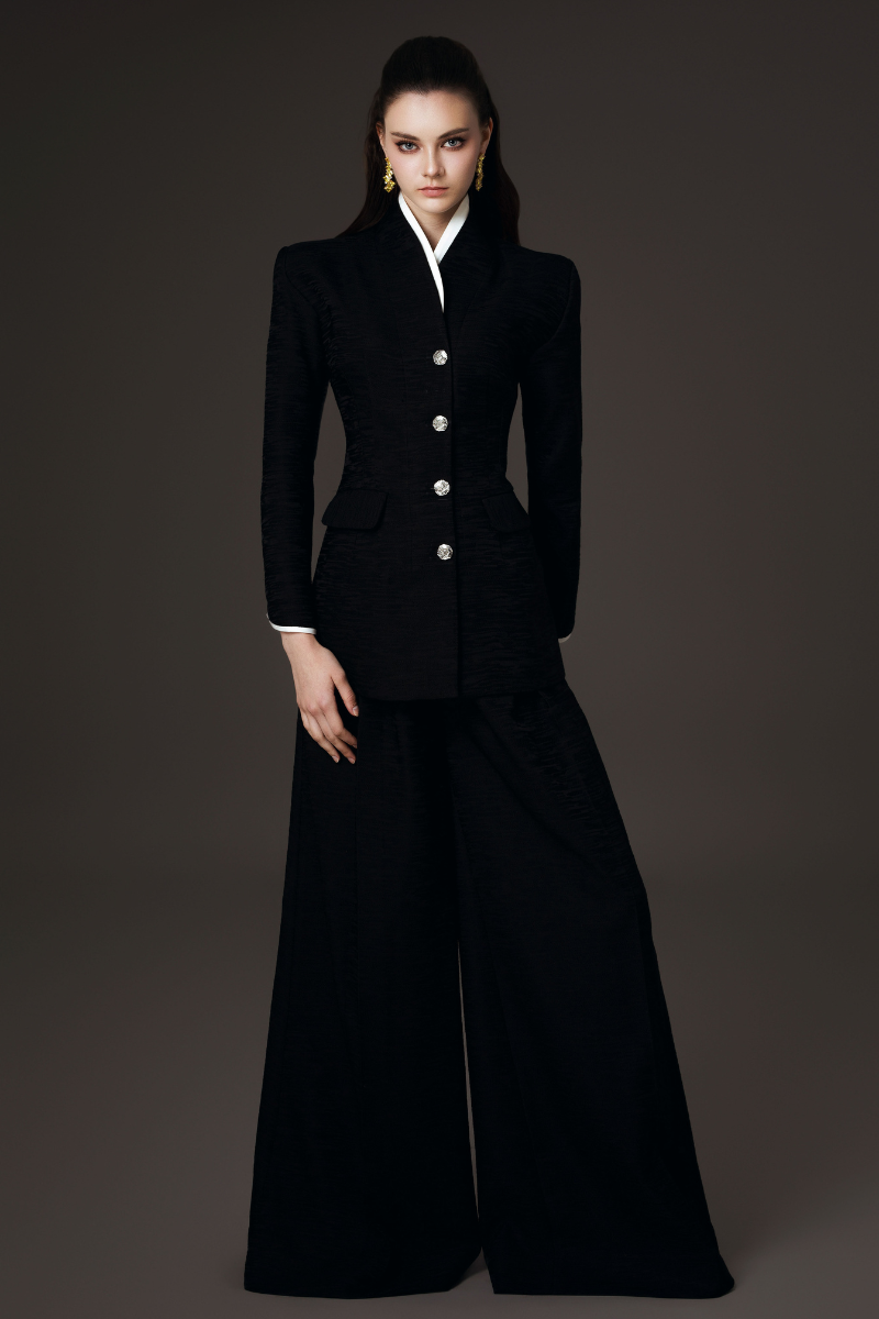 Valenciani high collar fitted blazer and wide-leg co-ord set displayed on a hanger, showcasing tailored design and stylish fit.