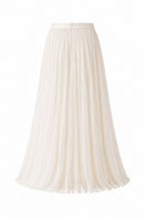 Nihan Peker Valentina vanilla maxi skirt displayed on a hanger, showcasing its flowy fabric and elegant length.