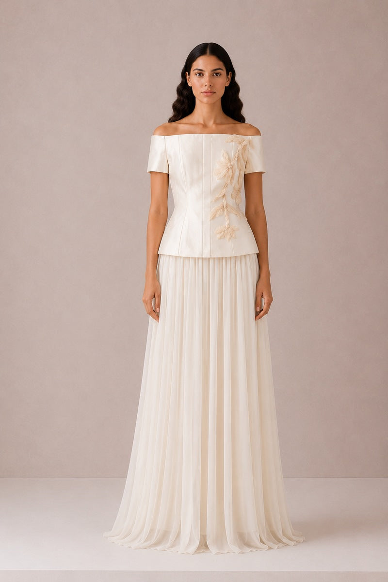 Nihan Peker Valentina Maxi Skirt in vanilla color, flowing fabric, side slit, and high waist design displayed in the image.