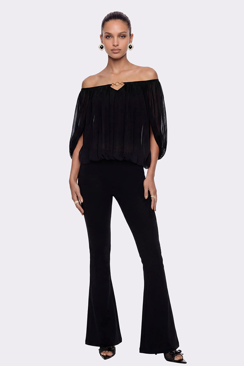 Nana Jacqueline Valeria black flared pants displayed on a model against a neutral background.