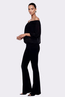 Black Valeria flared pants by Nana Jacqueline styled for a modern, chic look with a tailored silhouette.