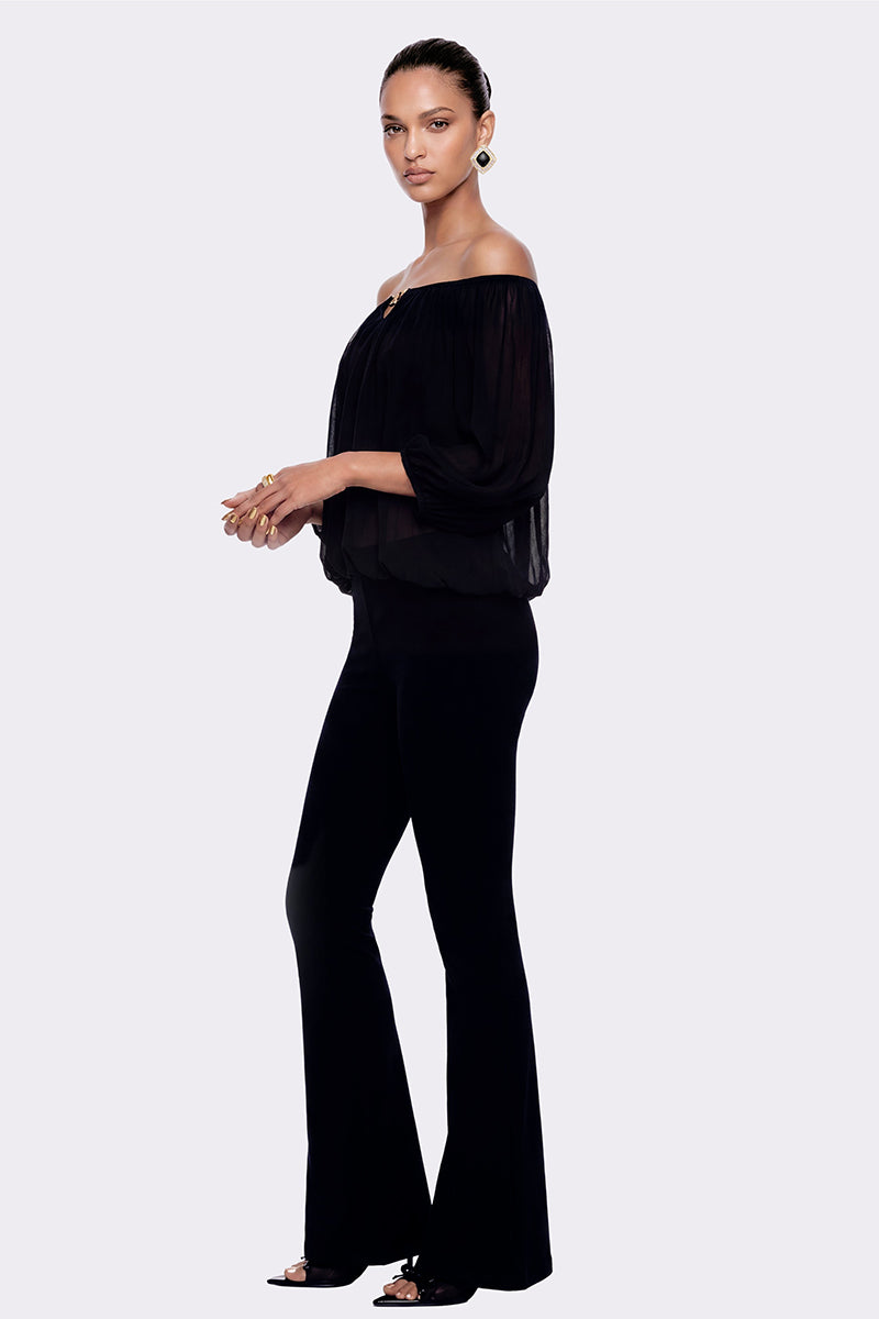 Black Valeria flared pants by Nana Jacqueline styled for a modern, chic look with a tailored silhouette.