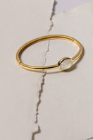 Sara Shala Venus bangle in yellow gold vermeil, showcasing a sleek, elegant bracelet with a smooth, polished finish.