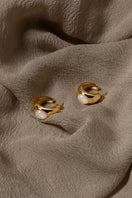 Sara Shala Venus earrings in yellow gold vermeil featuring elegant hoop design and intricate detailing.