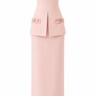 Light pink Vera dress by Nihan Peker, elegant gown with flowing fabric and subtle detailing, displayed on a hanger.