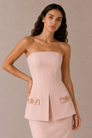 Light pink Vera gown by Nihan Peker, featuring flowing fabric and elegant design, displayed on a hanger against a neutral background.