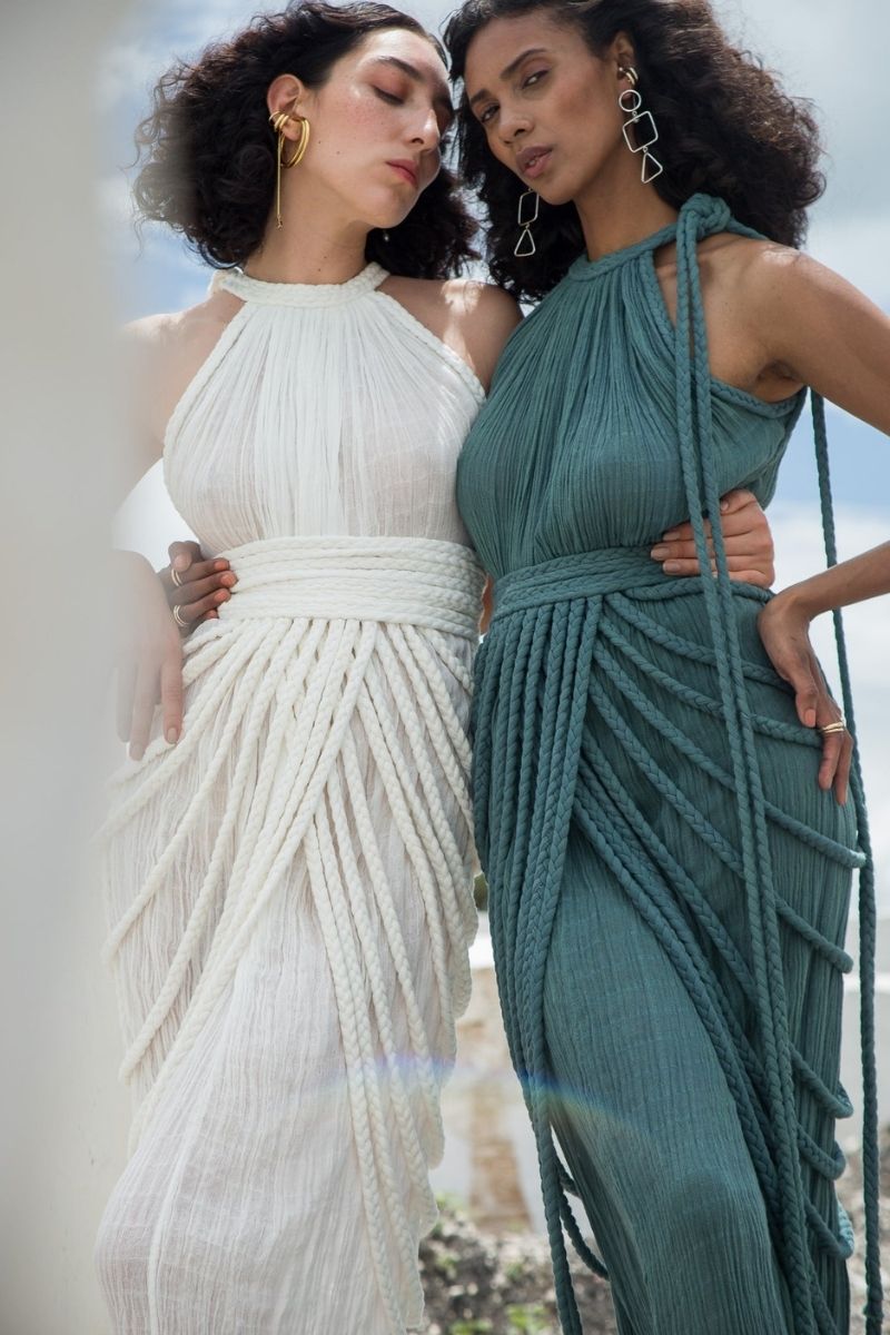 Kasia Kulenty Vera Aqua Gown, a flowing maxi dress in vibrant aqua with elegant fabric details and a graceful silhouette.