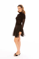Nana Jacqueline Verena black top displayed on a model, showcasing stylish women's casual tops with a relaxed fit.