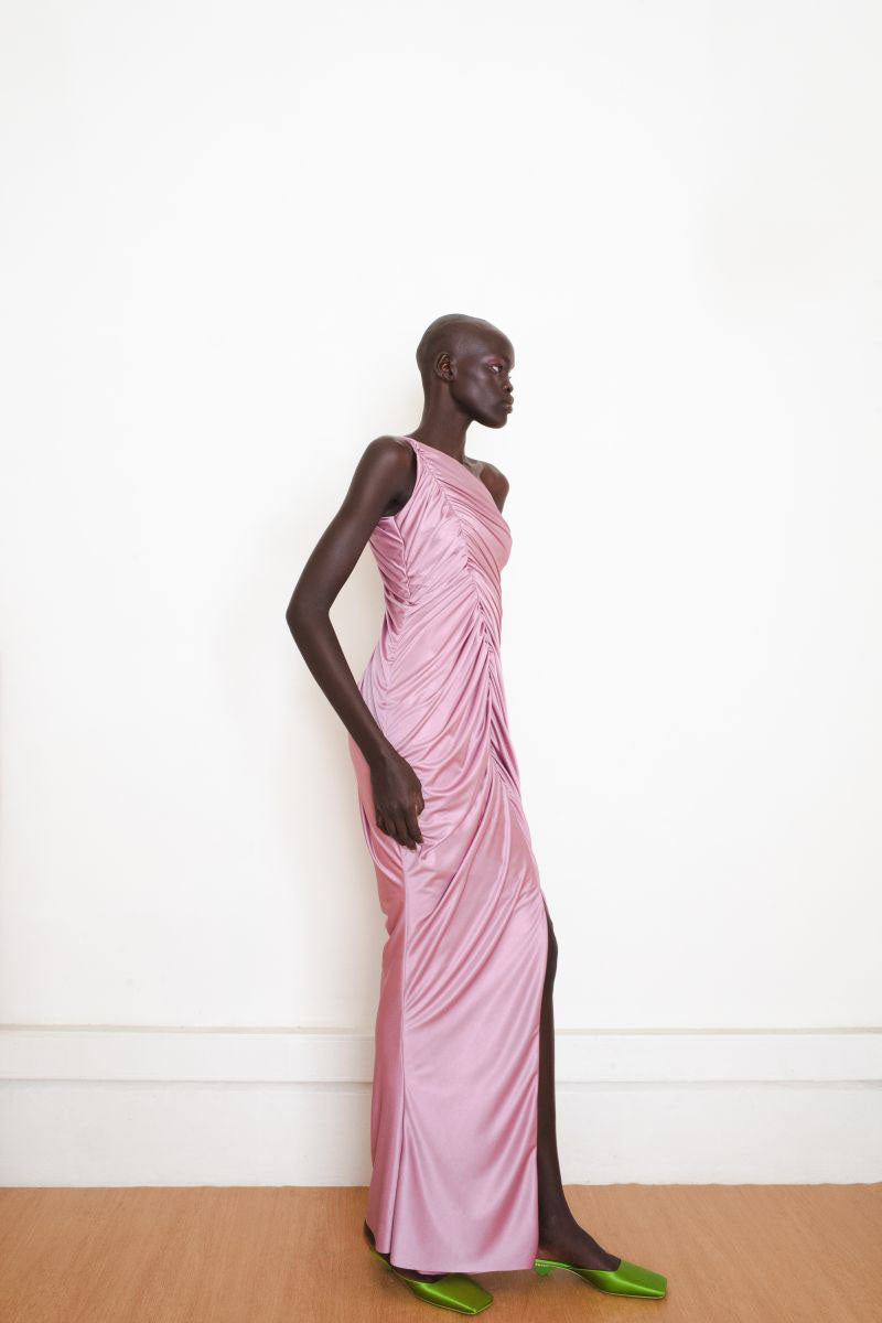 Pink Vestige gown by Yassmin Saleh, a stylish maxi dress shown from the side angle. Elegant and flowy fabric.