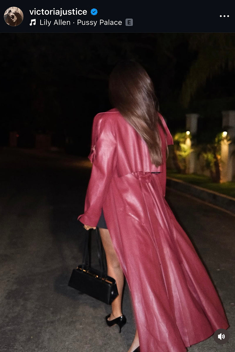 Victoria Justice wearing a burgundy vegan leather maxi trench coat with buckles by KRIS MARÁN.